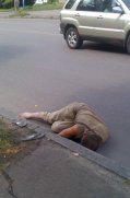 Homeless Person Laying in Street